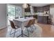 Open dining area with sliding glass door, features hardwood floors and natural lighting at 4084 Mountbatton Dr, Greenwood, IN 46143