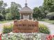 Community entrance sign 'Auburn Trace' surrounded by vibrant flowerbeds and a welcoming atmosphere at 4084 Mountbatton Dr, Greenwood, IN 46143