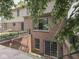 Brick exterior with a walkout basement, complemented by lush landscaping and a private patio at 4084 Mountbatton Dr, Greenwood, IN 46143