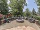 Outdoor brick firepit with patio, landscaping, and chairs at 4084 Mountbatton Dr, Greenwood, IN 46143