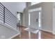Bright foyer featuring hardwood floors, modern staircase, and transom window at 4084 Mountbatton Dr, Greenwood, IN 46143
