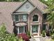 Charming brick home featuring manicured landscaping, a bay window, and an inviting entryway at 4084 Mountbatton Dr, Greenwood, IN 46143