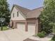Spacious three-car garage on a brick and siding home with basketball hoop and mature landscaping at 4084 Mountbatton Dr, Greenwood, IN 46143