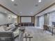 The home theater includes a projector screen, comfortable seating and a nearby desk space at 4084 Mountbatton Dr, Greenwood, IN 46143