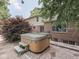 Backyard patio featuring a spa and mature landscaping at 4084 Mountbatton Dr, Greenwood, IN 46143