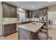 Open kitchen has granite countertops, stainless appliances, an island, and space for seating at 4084 Mountbatton Dr, Greenwood, IN 46143