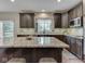 Bright kitchen features granite countertops, stainless steel appliances, and modern cabinets at 4084 Mountbatton Dr, Greenwood, IN 46143