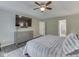 Cozy main bedroom boasts a tray ceiling, decorative rug, and calming neutral color palette at 4084 Mountbatton Dr, Greenwood, IN 46143