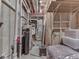 Exposed utilities and framing, this unfinished basement presents a blank canvas for customized expansion and storage solutions at 4084 Mountbatton Dr, Greenwood, IN 46143