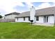 Lush backyard with green lawn, patio, and barbecue, ideal for summer entertaining at 413 Blue Spring Dr, Indianapolis, IN 46239