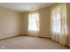 Cozy bedroom with neutral walls, carpet, and large windows adorned with decorative lace curtains for a light ambiance at 413 Blue Spring Dr, Indianapolis, IN 46239
