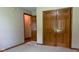Bedroom showcasing closet space and open doorway, offers practical storage and convenient flow at 413 Blue Spring Dr, Indianapolis, IN 46239