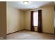 Bedroom features neutral walls, carpet and window with curtains, offering a cozy and versatile space at 413 Blue Spring Dr, Indianapolis, IN 46239