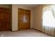 Bedroom showing closet and door, provides functional storage and access to other areas at 413 Blue Spring Dr, Indianapolis, IN 46239