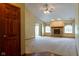 Cozy living room featuring a classic brick fireplace, neutral carpeting, and abundant natural light at 413 Blue Spring Dr, Indianapolis, IN 46239