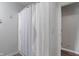 Bathroom featuring a striped shower curtain and white walls at 4155 Rolling Trails Rd, Greenwood, IN 46142