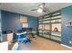 Office bedroom featuring two work stations, built-in shelving, and large windows for natural light at 4155 Rolling Trails Rd, Greenwood, IN 46142