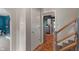 Bright hallway with wood floors, leading to a visible kitchen and additional living spaces at 4155 Rolling Trails Rd, Greenwood, IN 46142