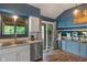 Well-lit kitchen features stainless steel appliances, granite countertops, and access to a sunroom at 4155 Rolling Trails Rd, Greenwood, IN 46142