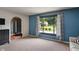 Comfortable living room with natural light, carpet floors, and view of front yard at 4155 Rolling Trails Rd, Greenwood, IN 46142