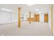 Unfinished basement with support beams, neutral carpet, and unfinished ceiling at 430 Oakbrook Dr, Columbus, IN 47201