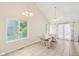 Sunlit dining area with a large window and tile floors, perfect for Gathering meals and gatherings at 430 Oakbrook Dr, Columbus, IN 47201