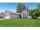 Home exterior with lawn and shade trees at 430 Oakbrook Dr, Columbus, IN 47201