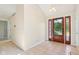 Inviting home foyer featuring tile flooring, ample lighting, and a welcoming atmosphere at 430 Oakbrook Dr, Columbus, IN 47201