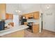 Bright kitchen features updated stainless steel appliances, including a refrigerator and gas range, perfect for cooking at 430 Oakbrook Dr, Columbus, IN 47201