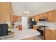 Spacious kitchen includes a peninsula with room for seating, stainless appliances, and plenty of cabinet space at 430 Oakbrook Dr, Columbus, IN 47201