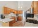 Charming kitchen featuring stainless steel appliances, light wood cabinets, and light countertops at 430 Oakbrook Dr, Columbus, IN 47201