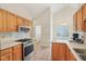Well-equipped kitchen features a stainless steel oven and microwave, with ample counter space for meal preparation at 430 Oakbrook Dr, Columbus, IN 47201
