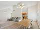 Open-concept living space boasts vaulted ceilings, ceiling fans, and a dining table with seating at 430 Oakbrook Dr, Columbus, IN 47201