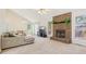 Comfortable living room with brick fireplace, plush seating, and dining area with view at 430 Oakbrook Dr, Columbus, IN 47201