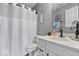 Clean bathroom with a white vanity, a dark faucet, and a shower-tub combination at 4420 Wild Turkey Dr, Indianapolis, IN 46239