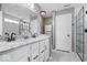 Modern bathroom with double vanity, granite countertops, and glass-enclosed shower at 4420 Wild Turkey Dr, Indianapolis, IN 46239
