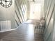 Inviting entryway featuring custom trim work, a neutral color palette, and decorative accents at 4420 Wild Turkey Dr, Indianapolis, IN 46239