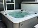 Close up of an outdoor hot tub filled with bubbly water at 4420 Wild Turkey Dr, Indianapolis, IN 46239