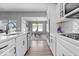 Bright white kitchen featuring subway tile backsplash, stainless appliances, and quartz countertops at 4420 Wild Turkey Dr, Indianapolis, IN 46239
