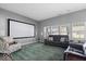 Comfortable living room with large screen, plush seating, and lots of natural light at 4420 Wild Turkey Dr, Indianapolis, IN 46239