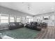 Open-concept living room with hardwood floors, neutral walls, and lots of natural light at 4420 Wild Turkey Dr, Indianapolis, IN 46239
