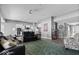 Spacious living room featuring a kitchen, hardwood flooring, and modern decor at 4420 Wild Turkey Dr, Indianapolis, IN 46239