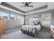 Serene main bedroom features tray ceilings, neutral colors, and ample natural light at 4420 Wild Turkey Dr, Indianapolis, IN 46239