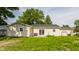 Spacious backyard featuring a lawn, patio, and back exterior of the house at 48 Wilson Dr, Carmel, IN 46032