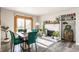Bright dining area features a table, fireplace, shelving, and sliding glass doors to let natural light in at 48 Wilson Dr, Carmel, IN 46032