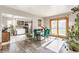 Open concept dining area with modern table, chairs, and sliding doors to outside area at 48 Wilson Dr, Carmel, IN 46032