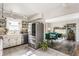 Bright kitchen featuring stainless steel appliances, tile flooring, and an open design to the dining area at 48 Wilson Dr, Carmel, IN 46032