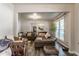 Spacious living room boasts an open layout, stylish seating, and plenty of natural light at 48 Wilson Dr, Carmel, IN 46032