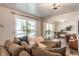 Inviting living room showcasing large windows, plush seating, and seamless transition to other living spaces at 48 Wilson Dr, Carmel, IN 46032