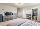 Bright main bedroom features a queen bed, ample storage with dressers, and a walk-in closet at 48 Wilson Dr, Carmel, IN 46032